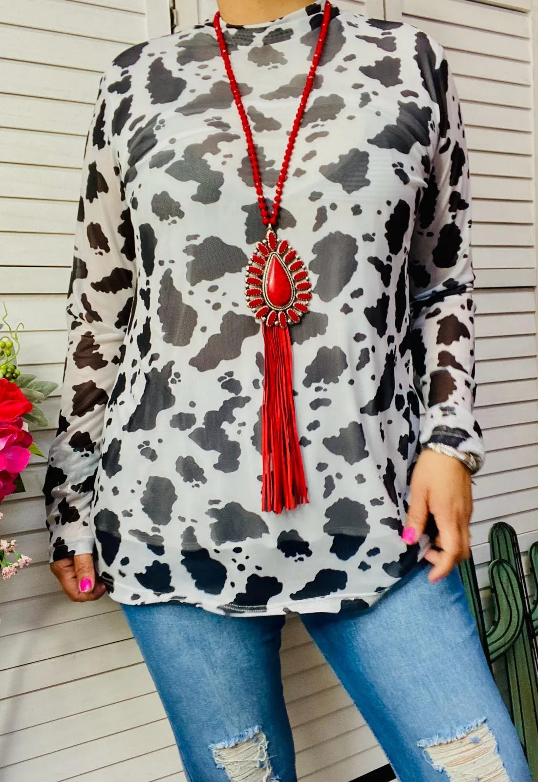 Black and White cow print top with sheer long sleeves